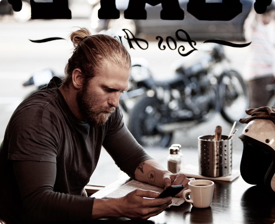 Image of man looking at phone